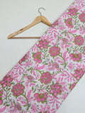 Pink floral cotton fabric with green leaves