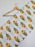 White cotton fabric with marigold floral print