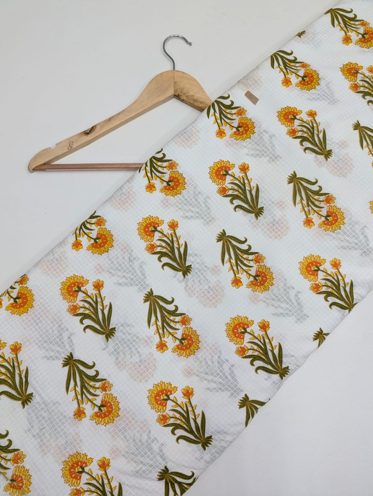 White cotton fabric with marigold floral print