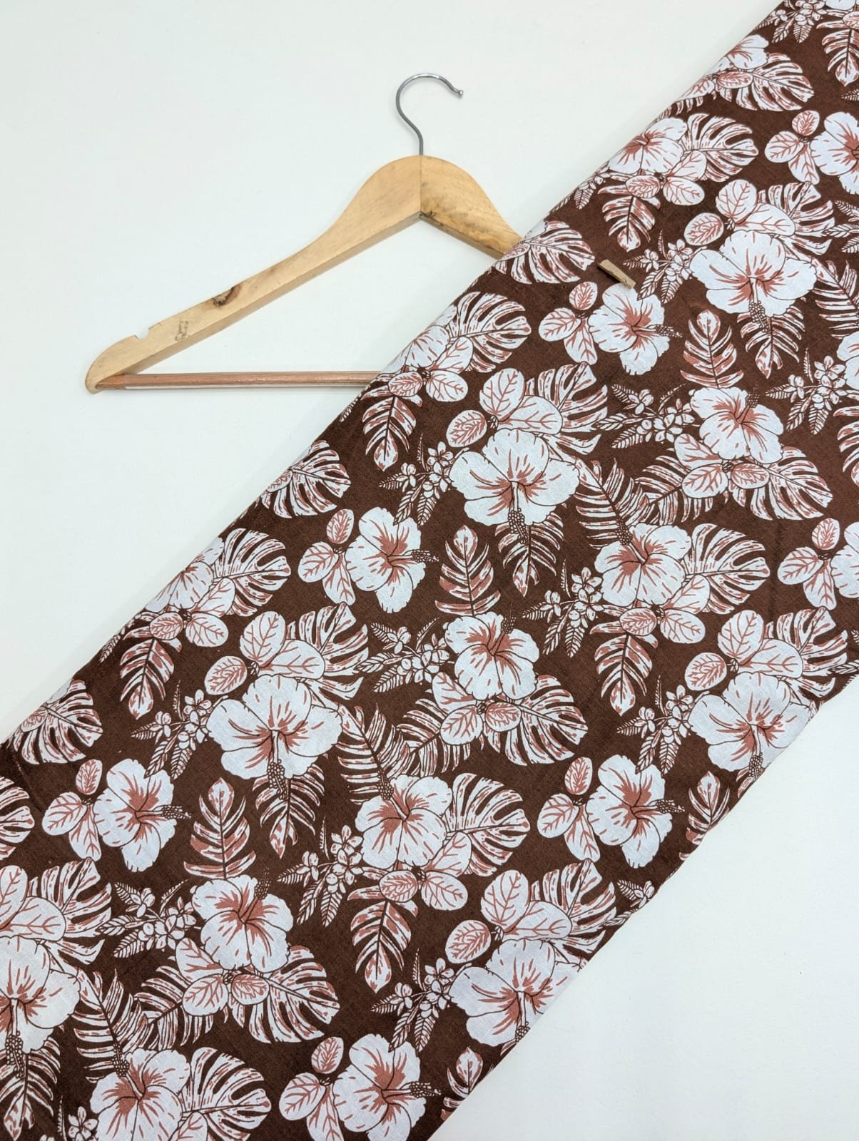 Brown cotton fabric with floral print design