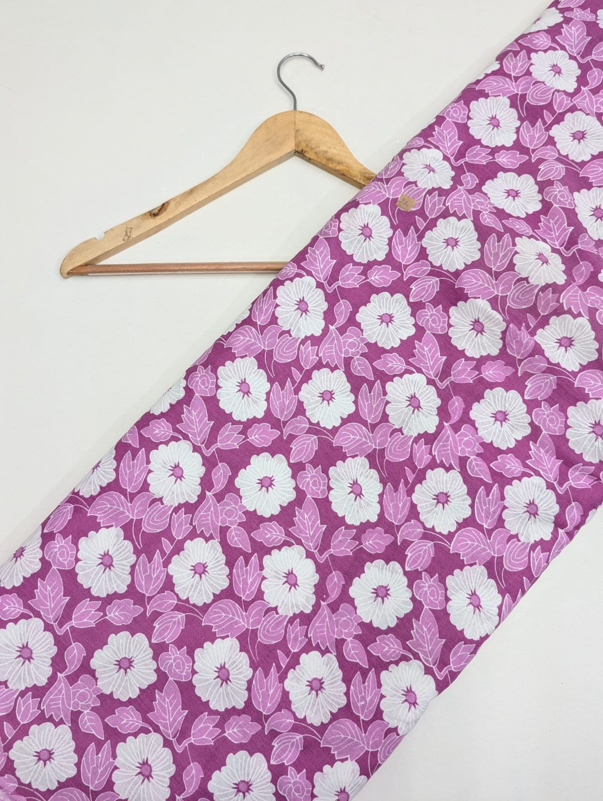 Pink fabric with white floral cotton print