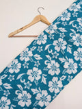 Teal fabric with white floral cotton print