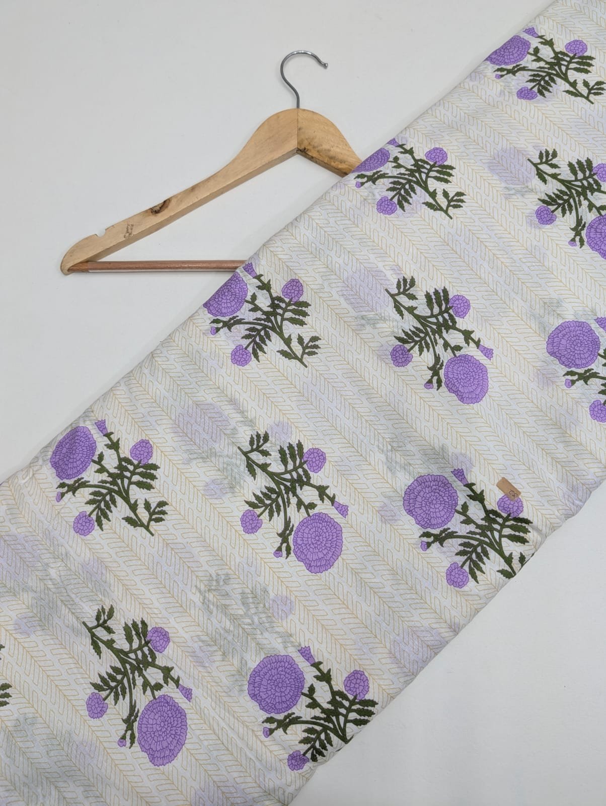 Cream fabric with purple floral cotton print