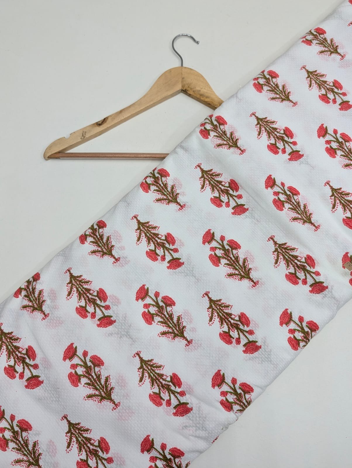 White cotton fabric with red floral print
