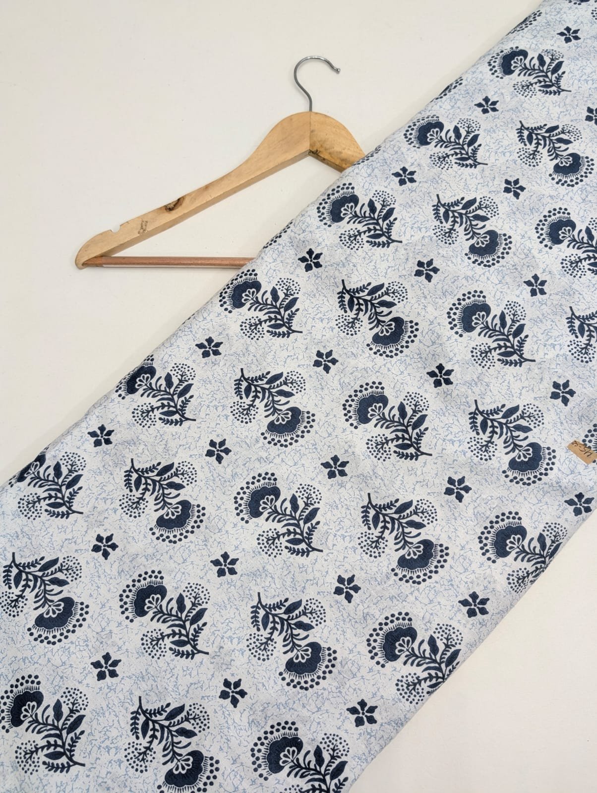 Light blue cotton fabric with dark blue paisley