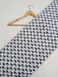 White cotton fabric with black floral motifs