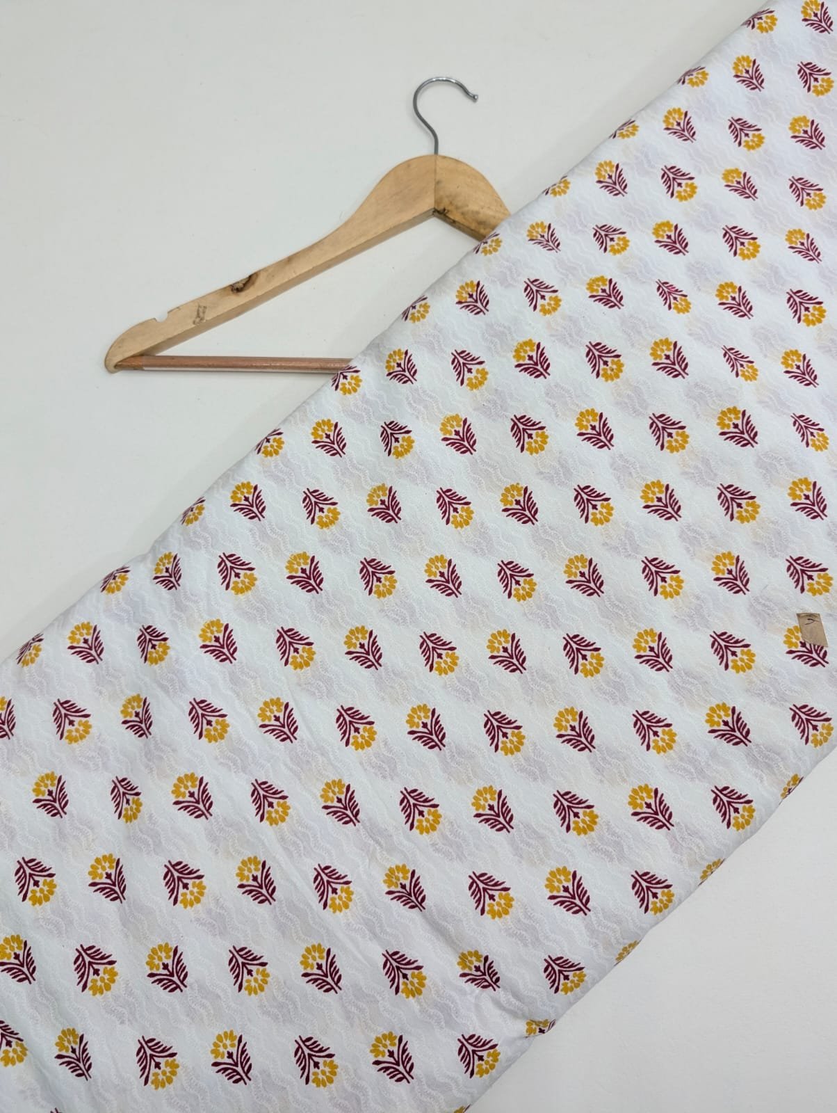 White cotton fabric with yellow and pink leaves