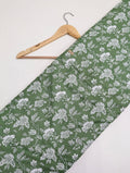 Green cotton fabric with white floral design