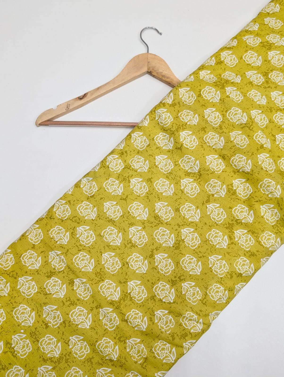 Green floral cotton fabric with white flowers