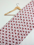 White cotton fabric with red floral print