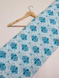 Blue paisley print on white cotton fabric
