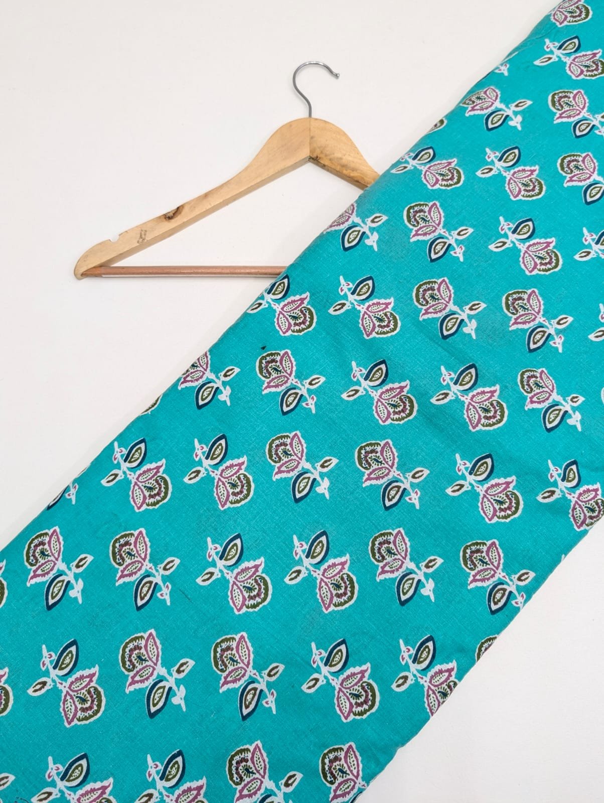 Teal leaf design on cotton fabric material
