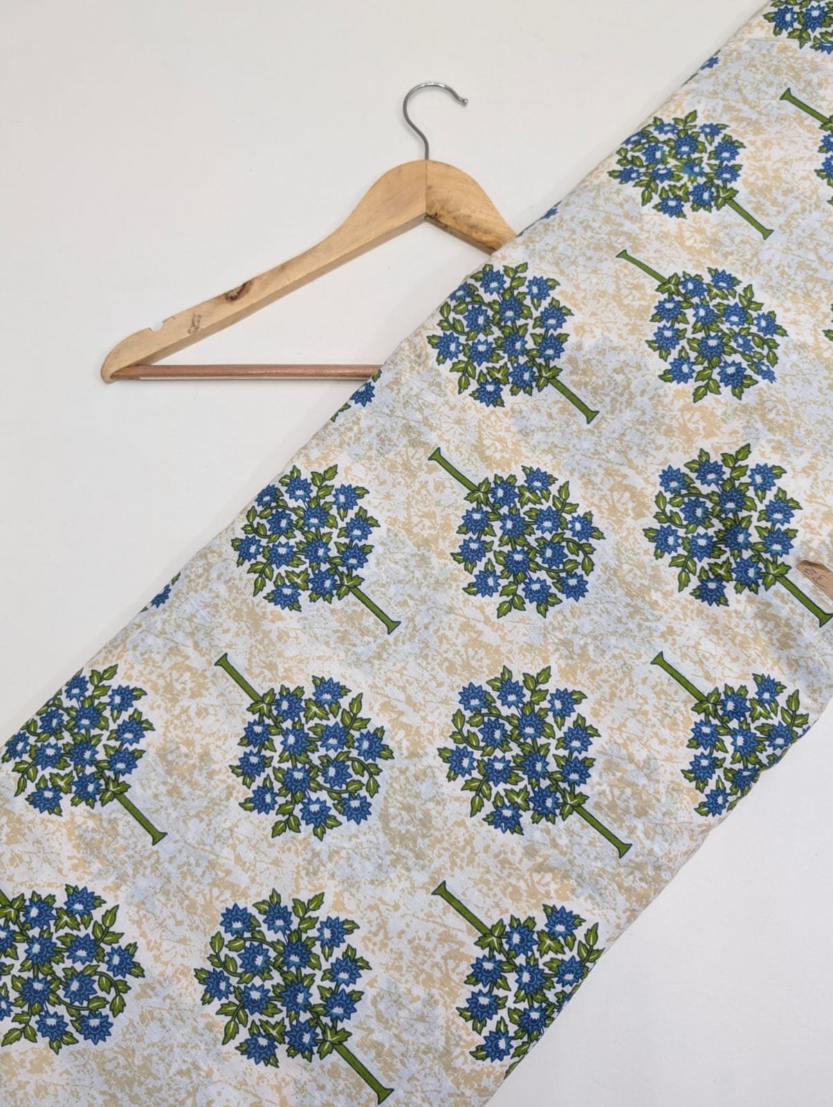 Blue floral tree print on light fabric