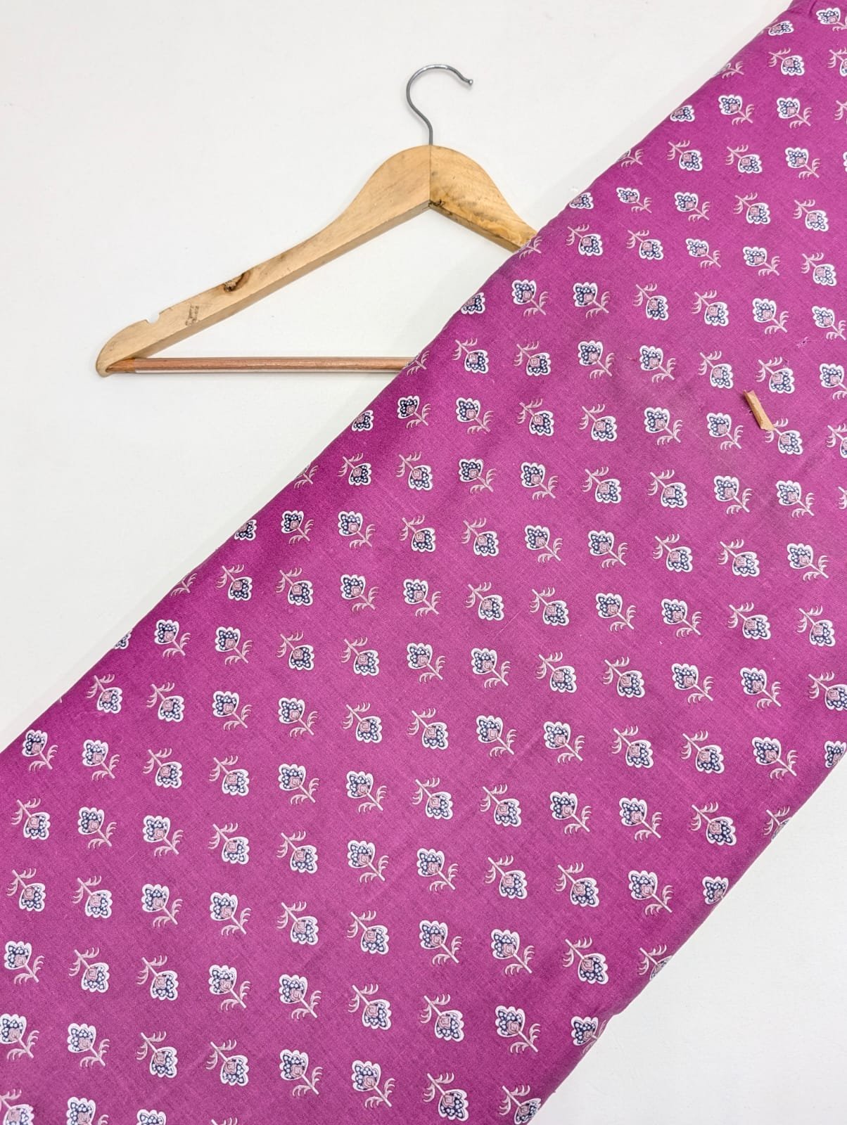 Pink cotton fabric with intricate small designs