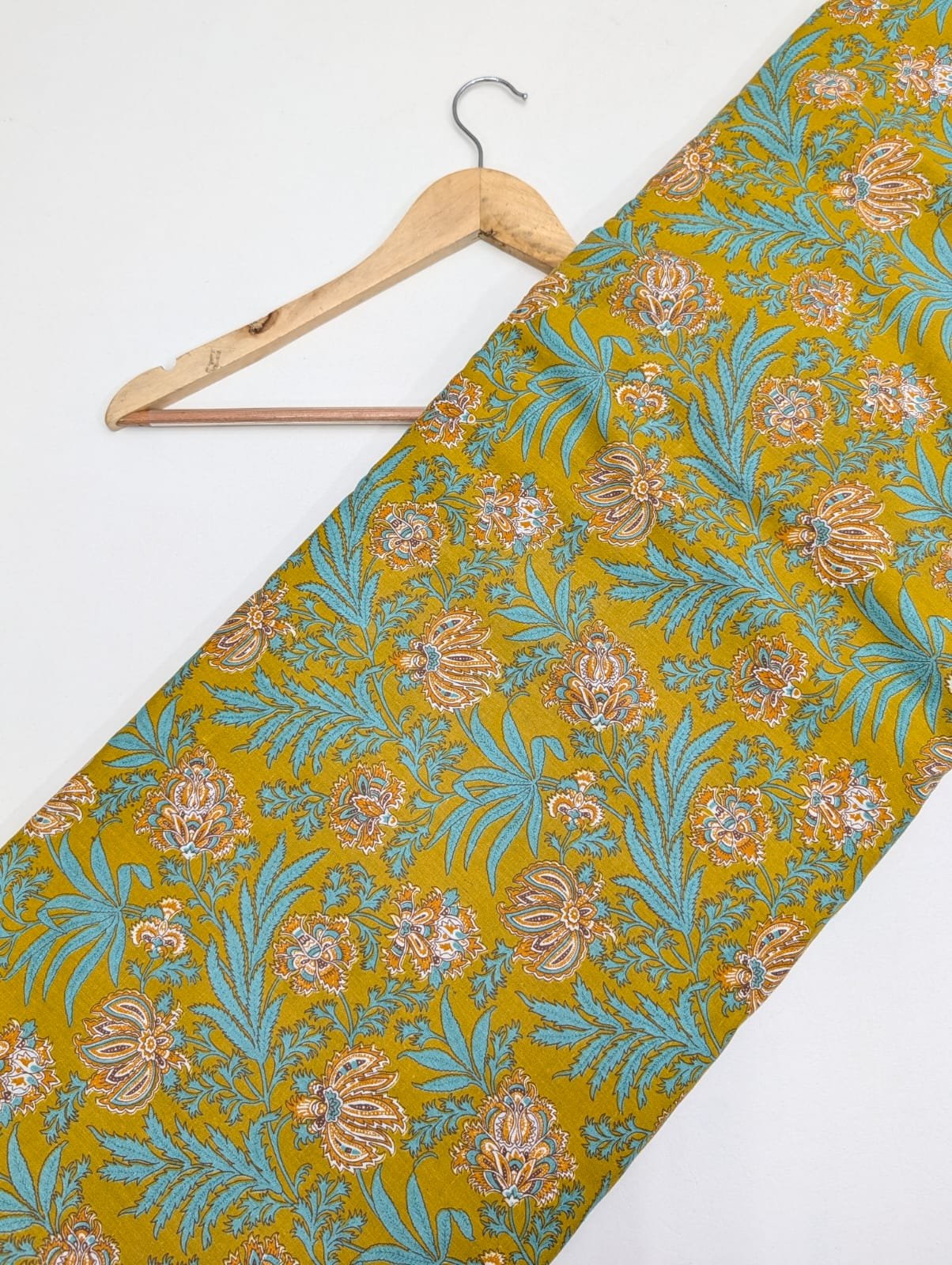 Yellow floral cotton fabric with traditional motifs