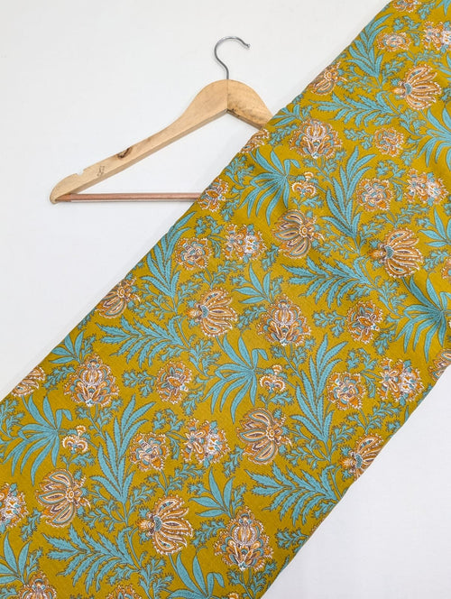 Yellow floral cotton fabric with traditional motifs