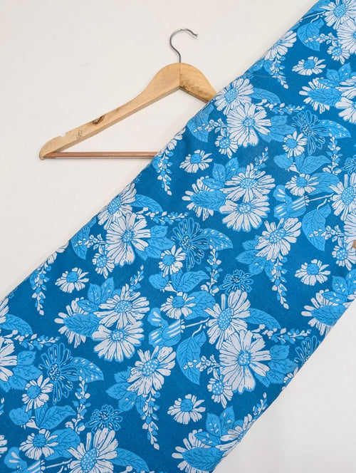 Blue floral cotton fabric with white flowers