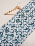 Teal cotton fabric with circular white motifs