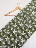 Green cotton fabric with white leaf pattern