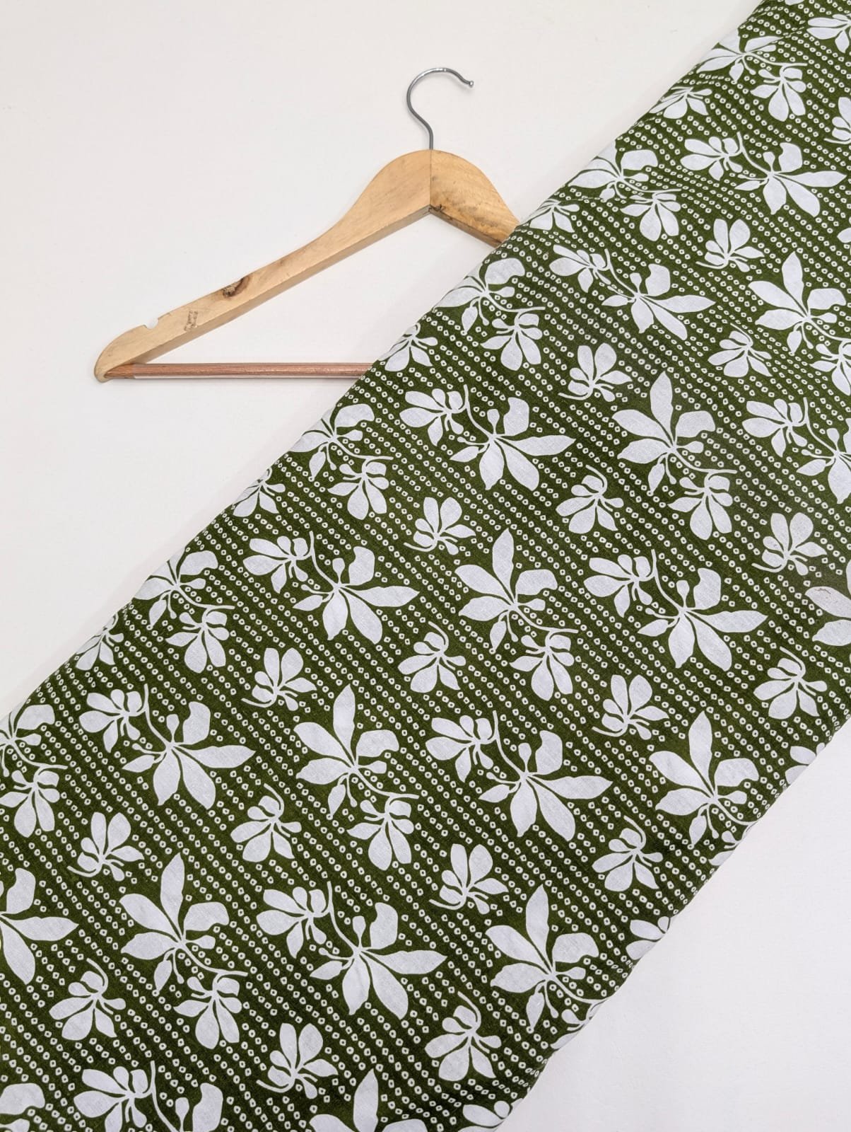 Green cotton fabric with white leaf pattern