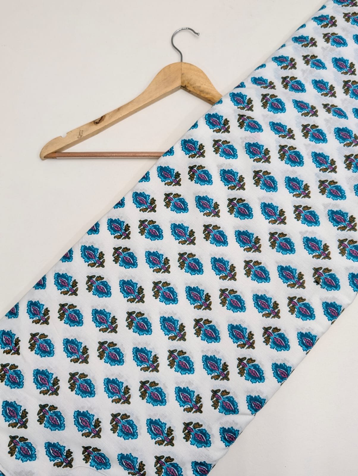 White cotton fabric with blue paisley prints