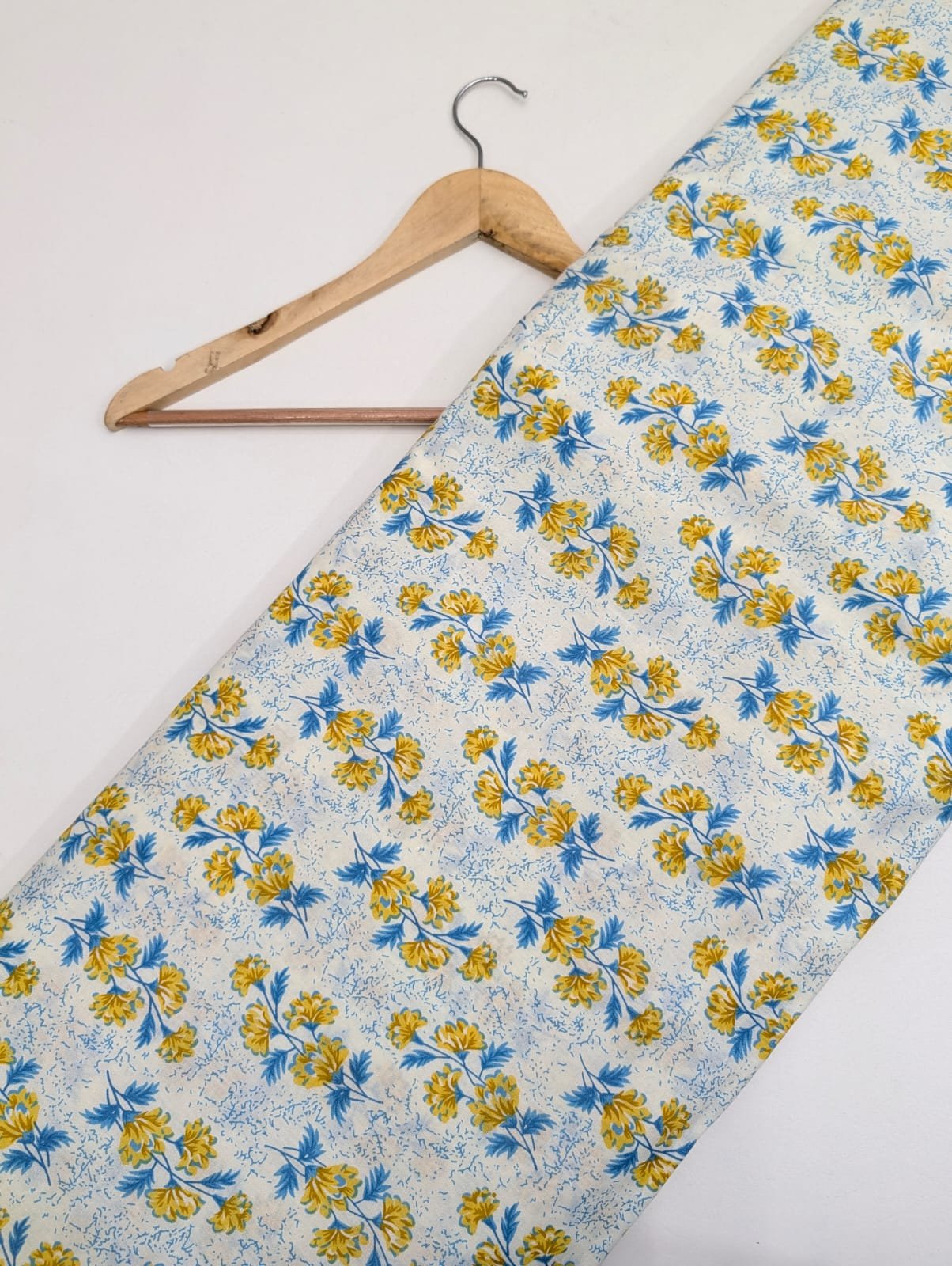 White cotton fabric with yellow floral prints