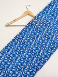 Blue cotton fabric with white floral pattern