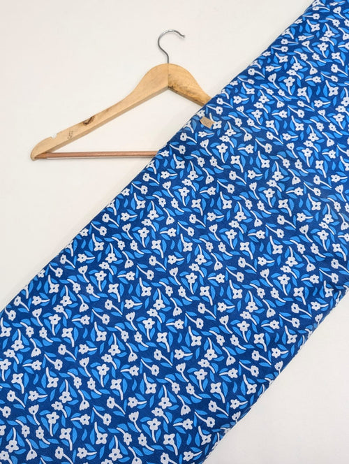 Blue cotton fabric with white floral pattern