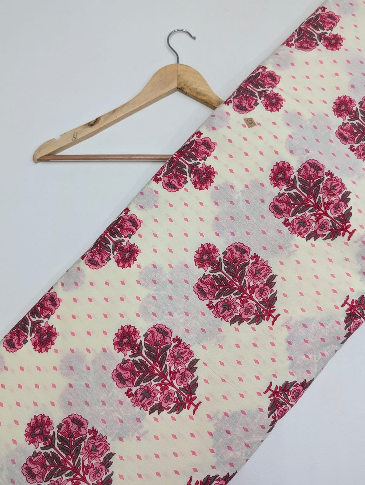 Cream cotton fabric with pink floral design