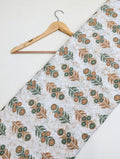 White floral cotton fabric with green brown print