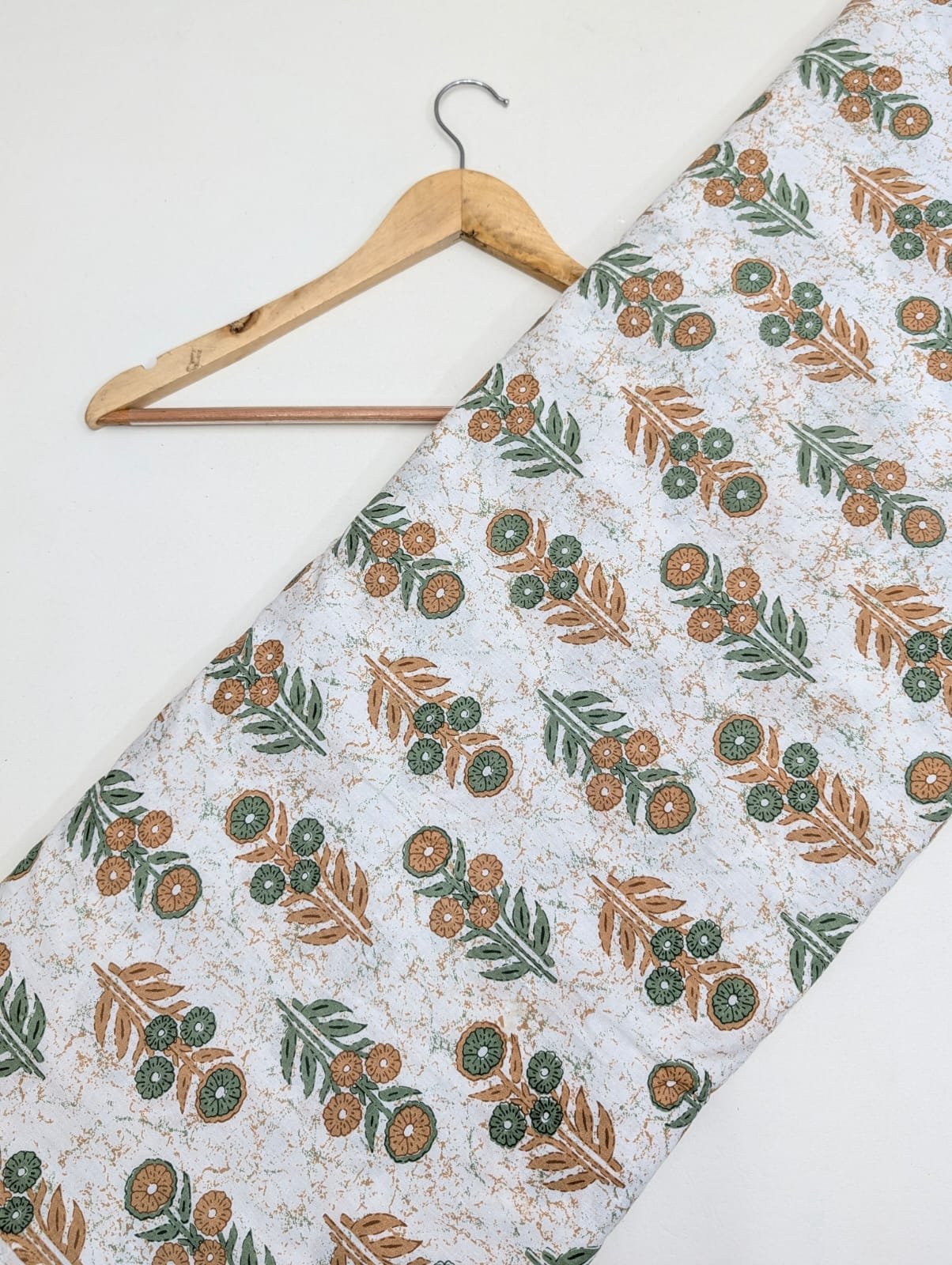 White floral cotton fabric with green brown print