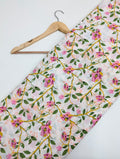 White cotton fabric with pink floral vine pattern