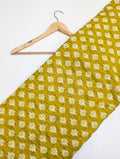 Yellow geometric cotton fabric with white design