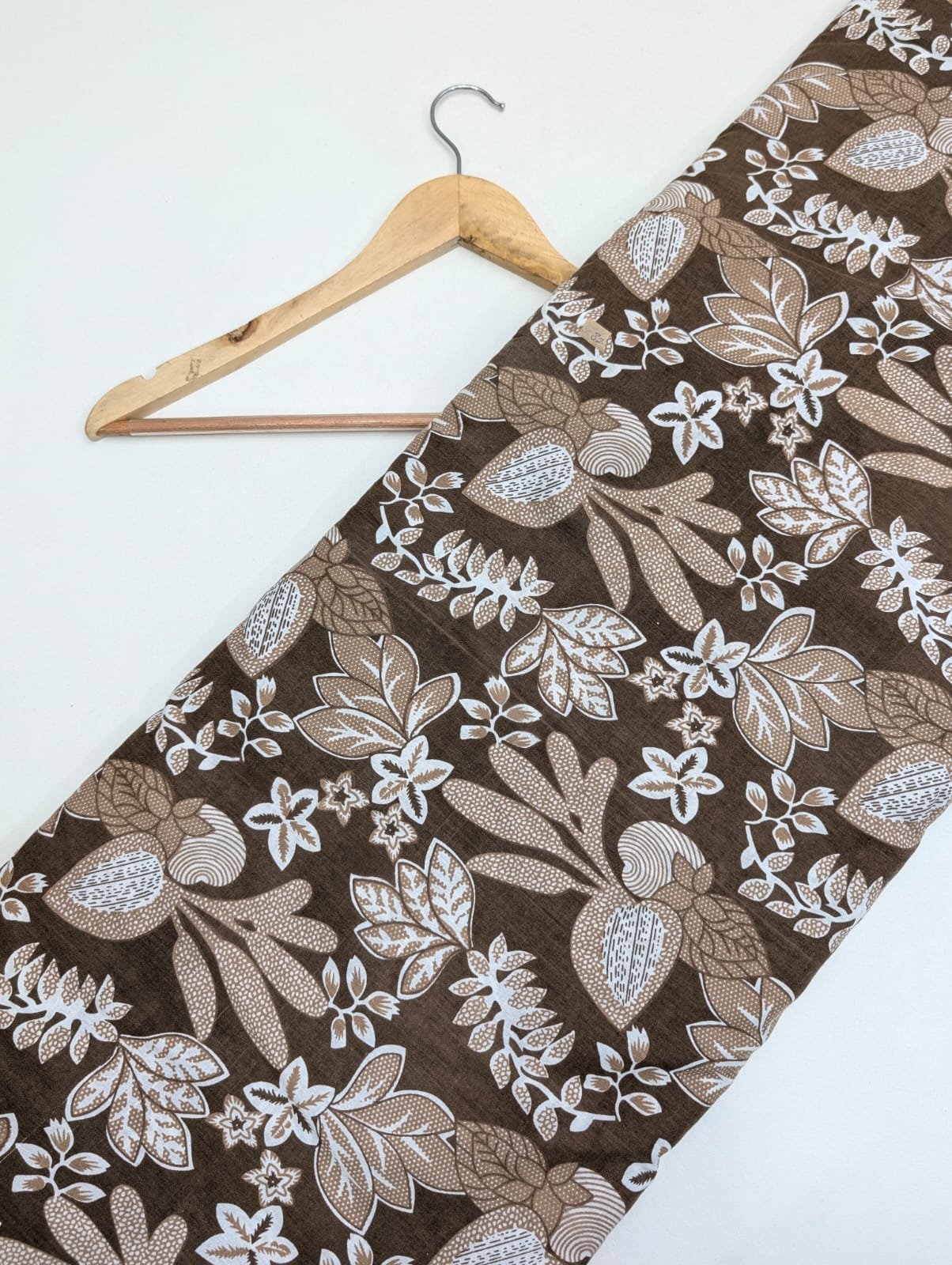 Brown floral cotton fabric with intricate design