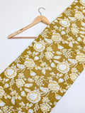 Mustard yellow floral cotton fabric with intricate design