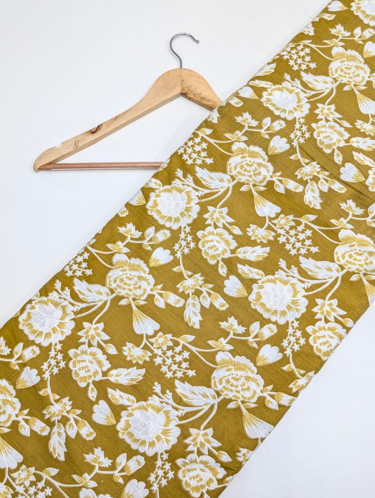 Mustard yellow floral cotton fabric with intricate design