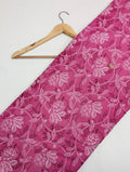 Pink cotton fabric with white floral design