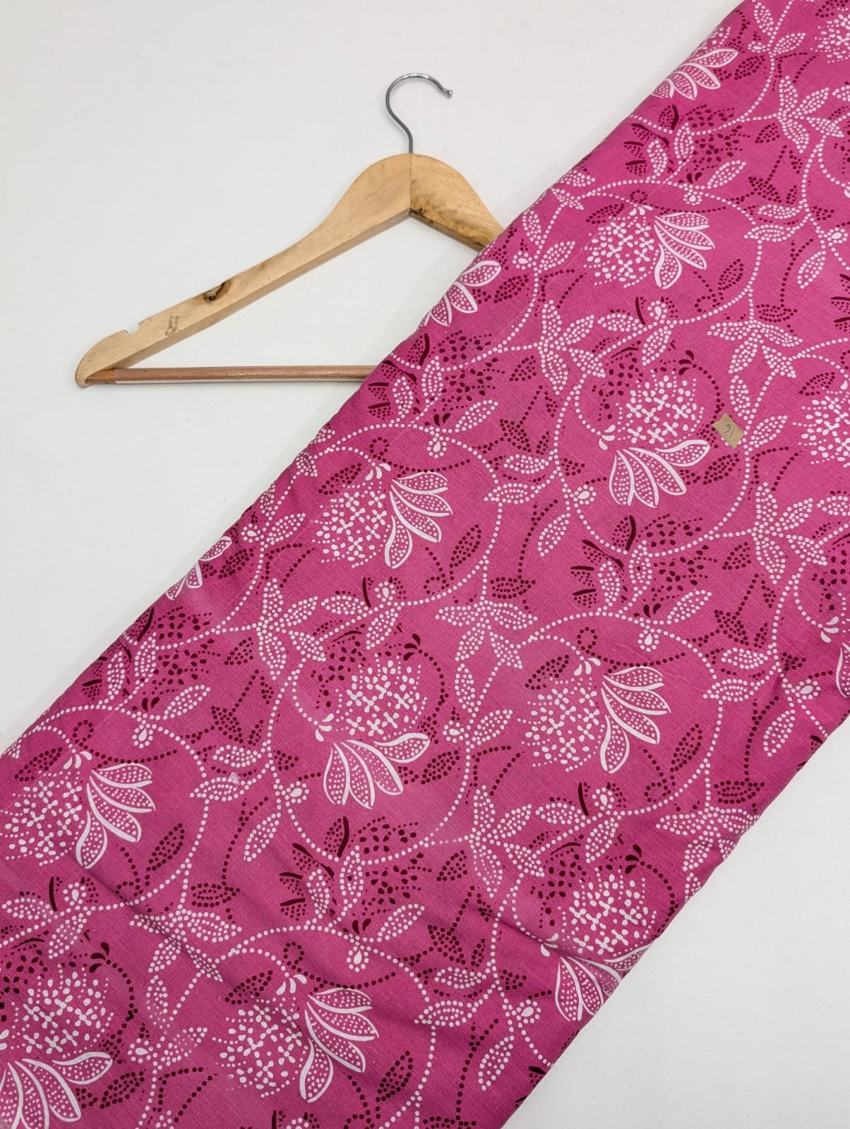 Pink cotton fabric with white floral design