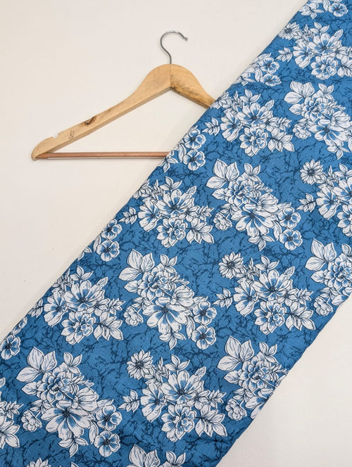 Blue floral cotton fabric with white flowers